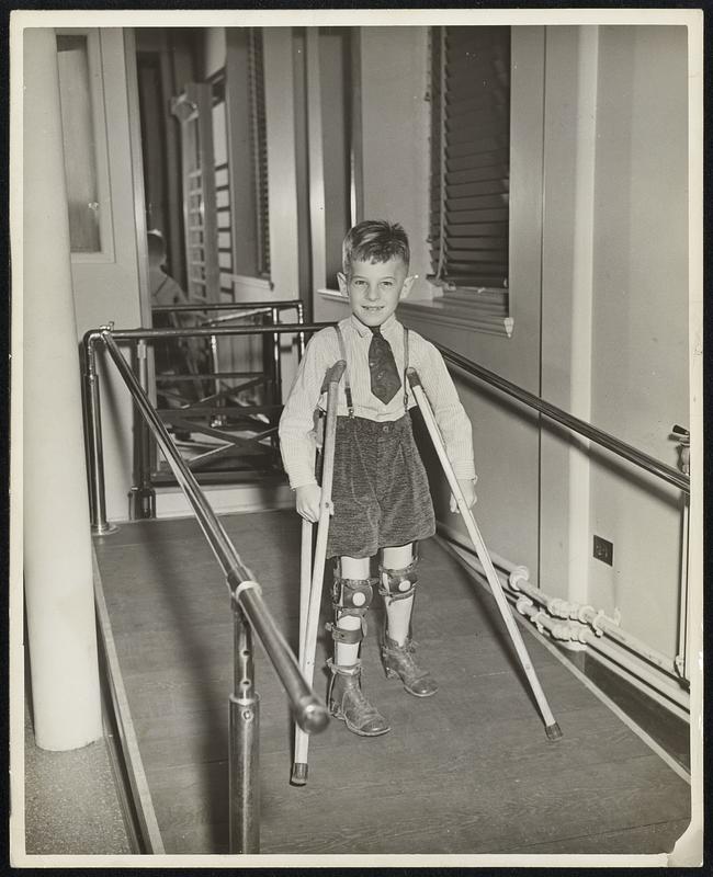 Billy Keeps His Chin Up...Billy Hearn, 7-year-old Quincy boy, who bravely fights infantile paralysis.He has seen other children recover and he knows that one day he play tag again.He receives treatment at the infantile paralysis clinic of the Children’s Hospital.