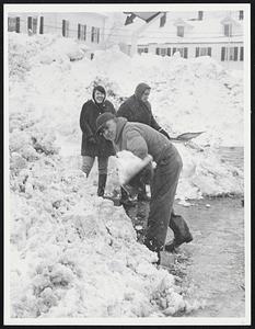 People shoveling snow
