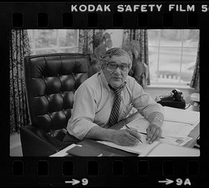 Peter Matthews at desk in office