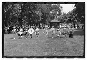 Group holding circular emblems