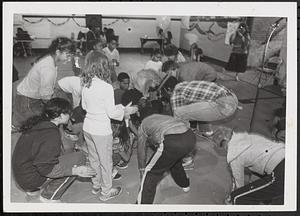 Group of kids participating in an activity for an event at Cambridge Community Art Center