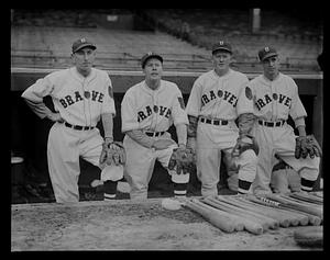 Four Boston Braves players in the dugout