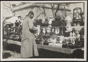 Man shopping at a street vendor