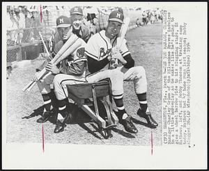 Bradenton, Fla. – Can You Manage, Charley? Manager Charley Grimm of the Milwaukee Braves indulges in a little horseplay as he makes like he’s going to give a wheel barrow ride to his slugging stars, Ed Mathews, left, and Bobby thomson at training camp today. Mathews had 47 home runs last season; Bobby slugged 26.