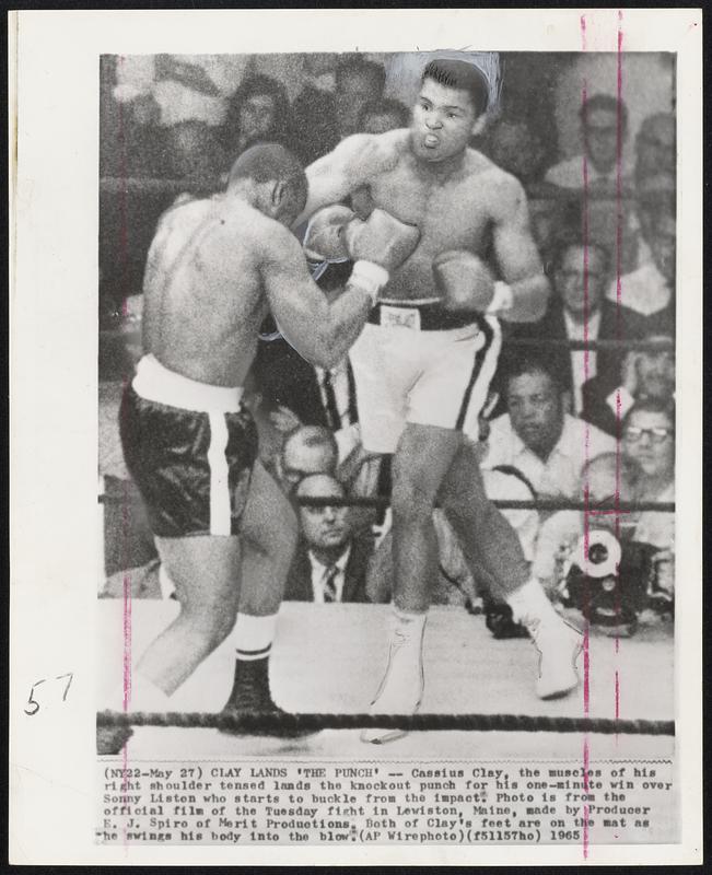 Cassius Clay, the muscles of his right shoulder tensed lands the knockout punch for his one-minute win over Sonny Liston who starts to buckle from the impact. Photo is from the official film of the Tuesday fight in Lewiston, Maine, made by Producer E. J. Spiro of Merit Productions. Both of Clay's feet are on the mat as he swings his body into the blow.