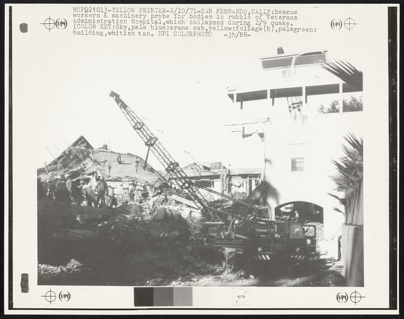 Rescue workers & machinery probe for bodies in rubble of Veterans Administration Hospital, which collapsed during 2/9 quake. (Color Key: Sky, pale blue: crane cab, yellow: foliage (R), palegreen: building, whitish tan.