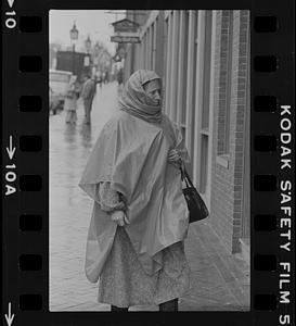 Woman wearing rain poncho