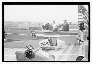 Boston Traveler Soap Box Derby, Boston Parks Commissioner William Long with hand on lever