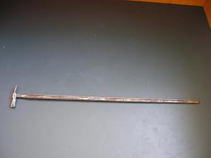 Long metal tool with small hammer head