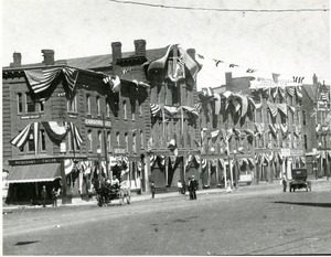 South side of Main Street en fete July 1916: streetscape Southbridge Massachusetts