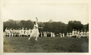 Woman in motion with children at Wellsworth Field Southbridge Massachusetts during the Centennial Celebrations