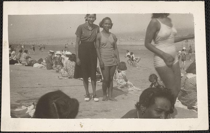 Two women pose at Revere Beach