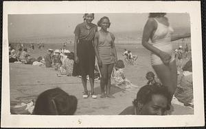 Two women pose at the beach