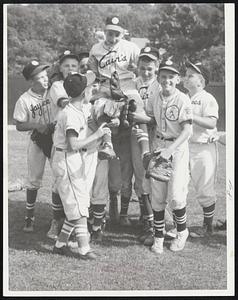 Raising Cain-Steve Pizzi gets royal escort off the field yesterday after pitching Weymouth Federal to a 4-0 victory over Fall River Federal in a state Little League quarter-final game at Watson Park, East Braintree.