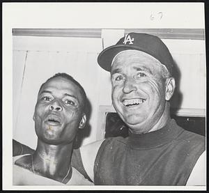 Homecoming to Los Angeles was a pleasant trip because Charley Neal (left) hit two homers and accounted for three runs in the 4-3 victory over the Chicago White Sox. Neal weighs only 156 pounds, but he had the power in the second game of the World Series. The accounts for Manager Walter Alston’s big smile.
