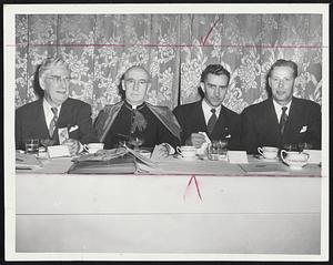 Testimonial Banquet for Secretary of Labor Tobin, extreme right, was held yesterday at the East Newton street armory by members of the Catholic Order of Foresters from all parts of the United States and Canada. Left to right: Thomas R. Heaney, international high chief ranger; the Rt. Rev. Msgr. Augustine F. Hickey and Louis E. Caron, high court trustee and New England supervisor, who served as toastmaster.