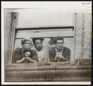 Student Protestors appear at window of Williams College administration building.