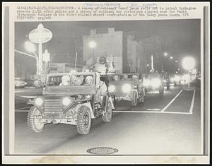 A convoy of National Guard jeeps rolls out to patrol Washington streets 11/14 after police and a throng of militant was protesters clashed near the South Vietnamese Embassy in the first violent street confrontation of the 3-day peace march.