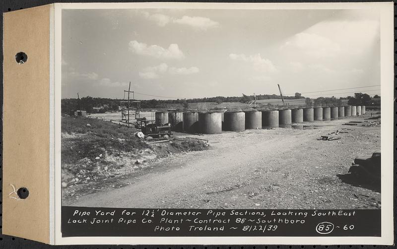 Contract No. 85, Manufacture and Delivery of Precast Concrete Steel Cylinder Pipe, Southborough, Framingham, Wayland, Natick, Weston, pipe yard for 12 and a half foot diameter pipe sections, looking southeast, Southborough, Mass., Aug. 22, 1939