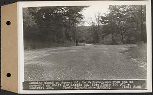 Contract No. 106, Improvement of Access Roads, Middle and East Branch Regulating Dams, and Quabbin Reservoir Area, Hardwick, Petersham, New Salem, Belchertown, looking ahead on access road to East Branch Dam from end of pavement on Shaft 12 access road, Belchertown, Mass., Sep. 19, 1945