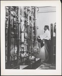 Typical set-up for experiments in distillation is this rack in the chemistry section of Naval Research Laboratory