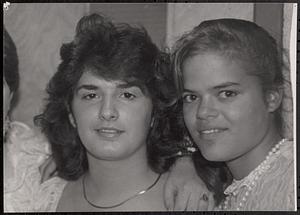 April Postell, right, and a friend at 8th grade graduation
