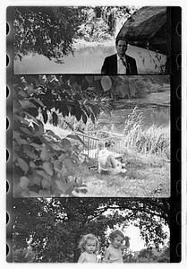 Maude Sanromá next to a playpen holding a child