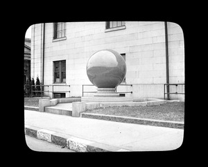 Granite ball on lawn of City Hall