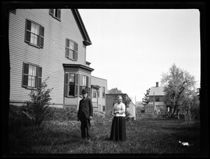 View of a couple in front of a house