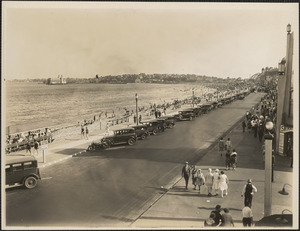 Cars parked by Revere Beach