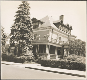 House with large tree in front
