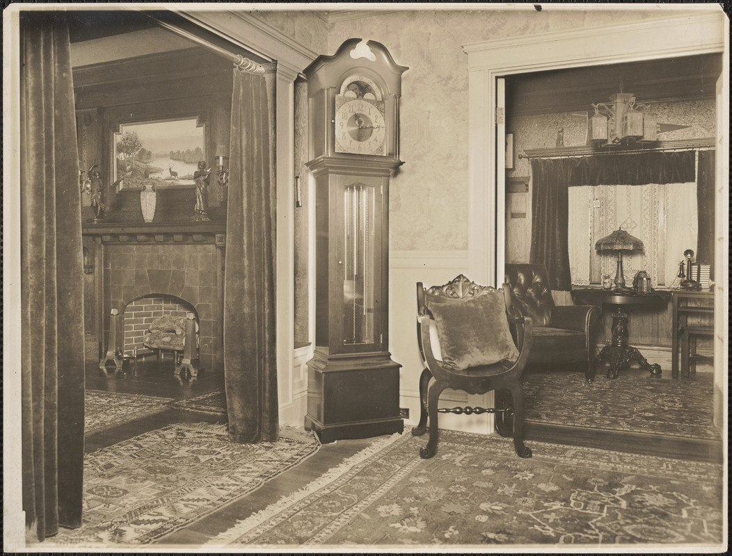 Fireplace, grandfather clock, and chair
