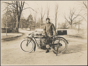 Man and motorized bicycle
