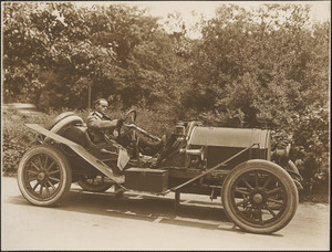 Man in open automobile