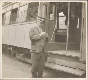 Street railroad employee writing notes