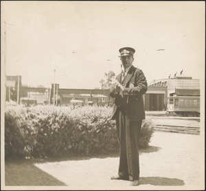 Street railroad employee in front of station