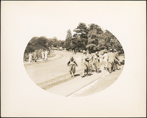 People walking along road