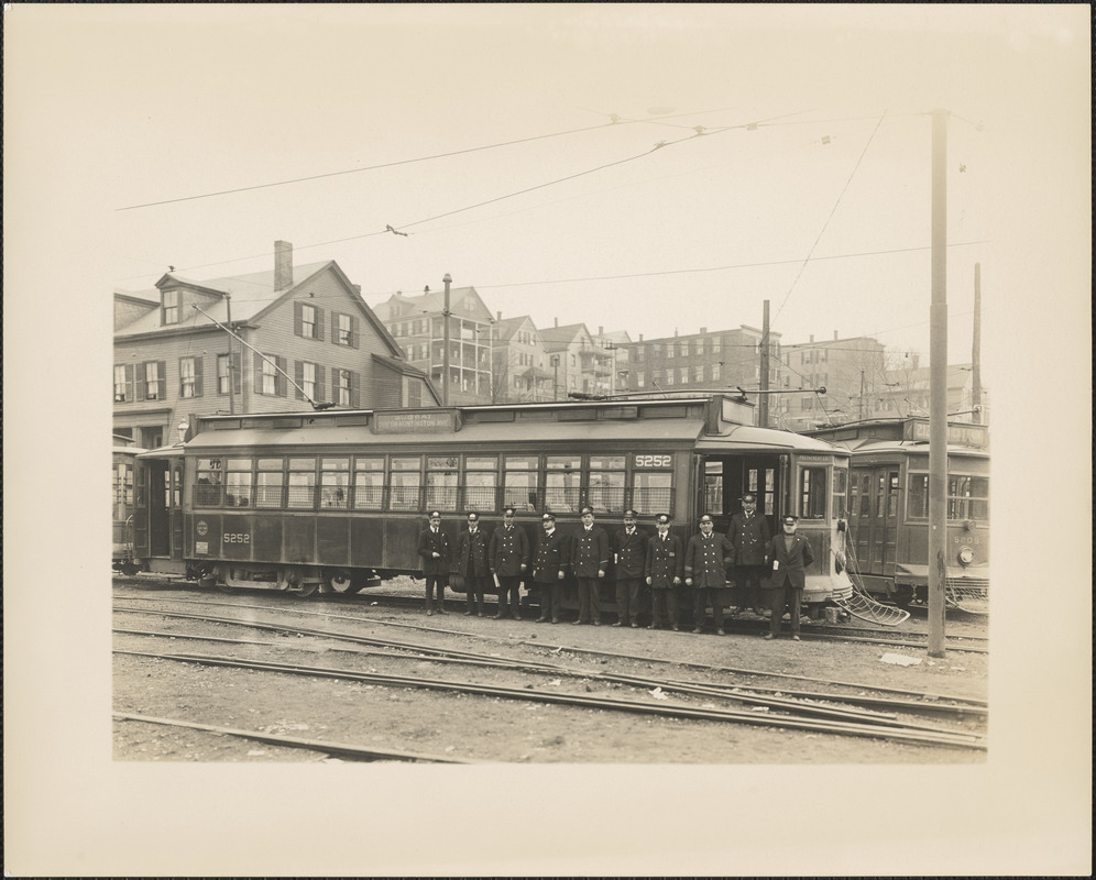 Ten street railway employees in front of South Huntington Avenue streetcar