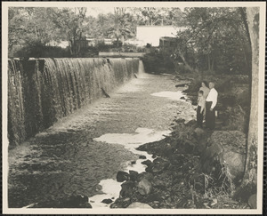 Henry, Mary and John Hutchings standing by a waterfall