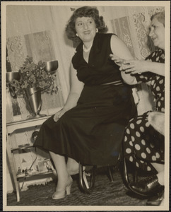 Seated woman and Mary Bayaghlanian