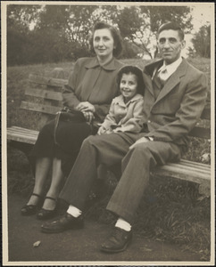 Man, woman and child on bench