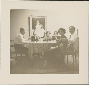 Group of people around dinner table, including Leon and Santough Abdalian