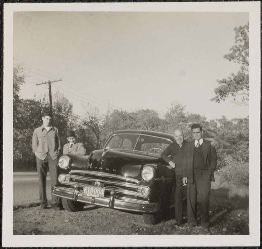 Leon Abdalian, Hagop, Paul and Albert Arzouhaljian posing with a Dodge