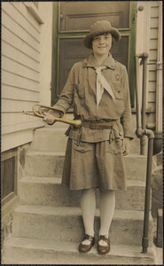Lillian Abdalian in girl scout uniform holding bugle