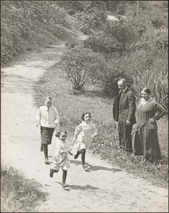 Leon and Alma watch Herman, Lillian, and Marian Abdalian run along a path