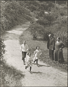 Leon and Alma watch Herman, Lillian, and Marian Abdalian run along a path