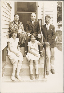 Leon, Alma, Herman, Lillian, and Marian Abdalian posing by a door