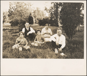 Leon, Alma, Herman, Lillian, and Marian Abdalian sitting in a field