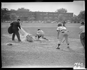 Sliding into home base during a SC J.V. baseball game