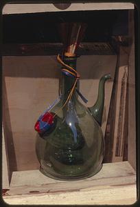 Green glass pitcher in shop window